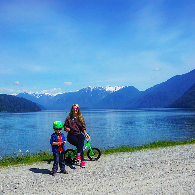 mother and child taking photos at Rannie Road in Pitt Lake Ecological Reserve, near Pitt Meadows, BC