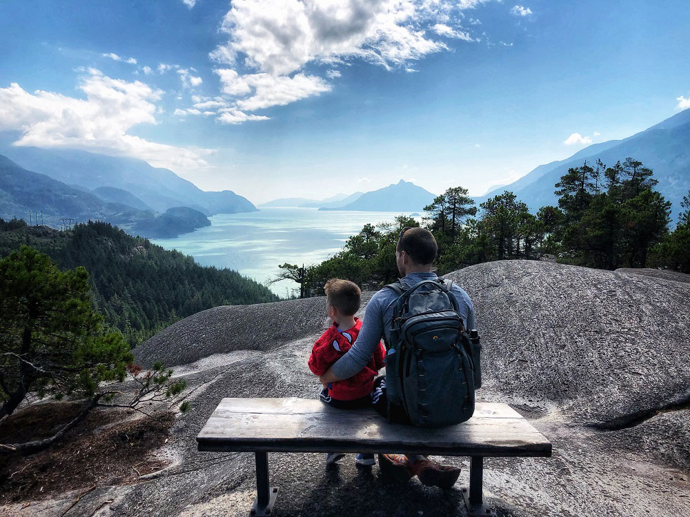 father and child enjoying the view of Howe Sound from the Jurassic Ridge hiking trail