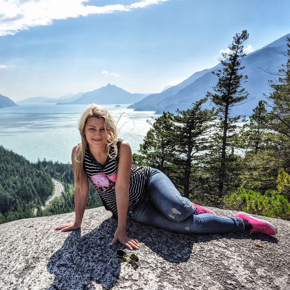 posing for a photo at the Howe Sound lookout - summer sun hike near Squamish