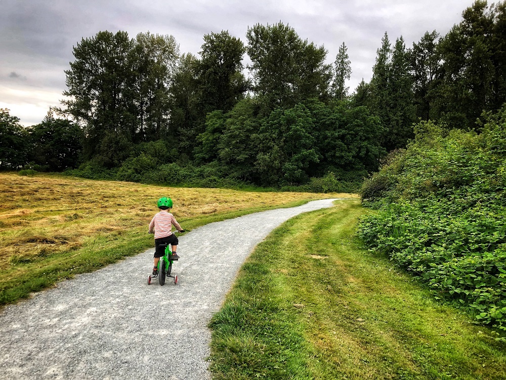 Fort to Fort trail in Derby Reach Regional Park - child on a bike
