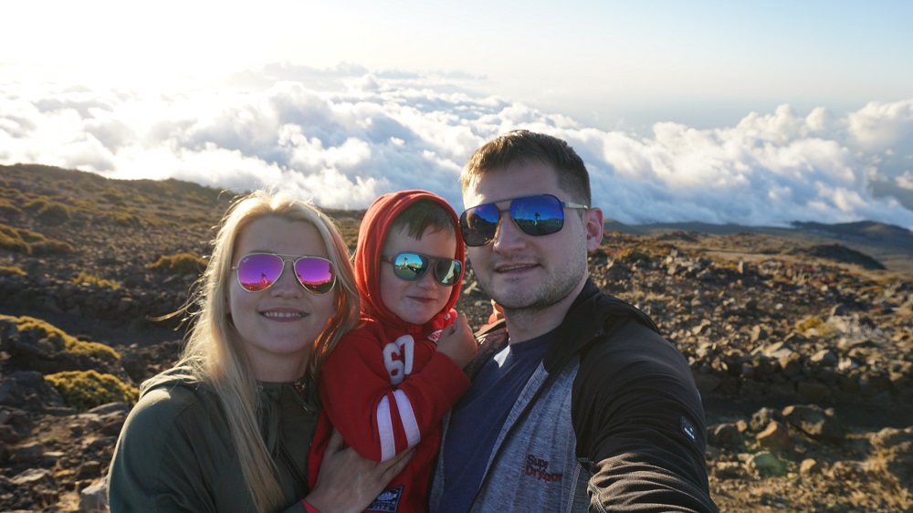 family photo above the clouds and the views of Haleakala volcano at Maui Hawaii