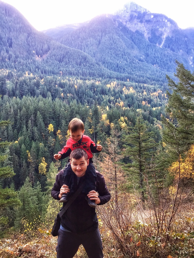 child and father outdoors on a hiking trail through Coquihalla canyon
