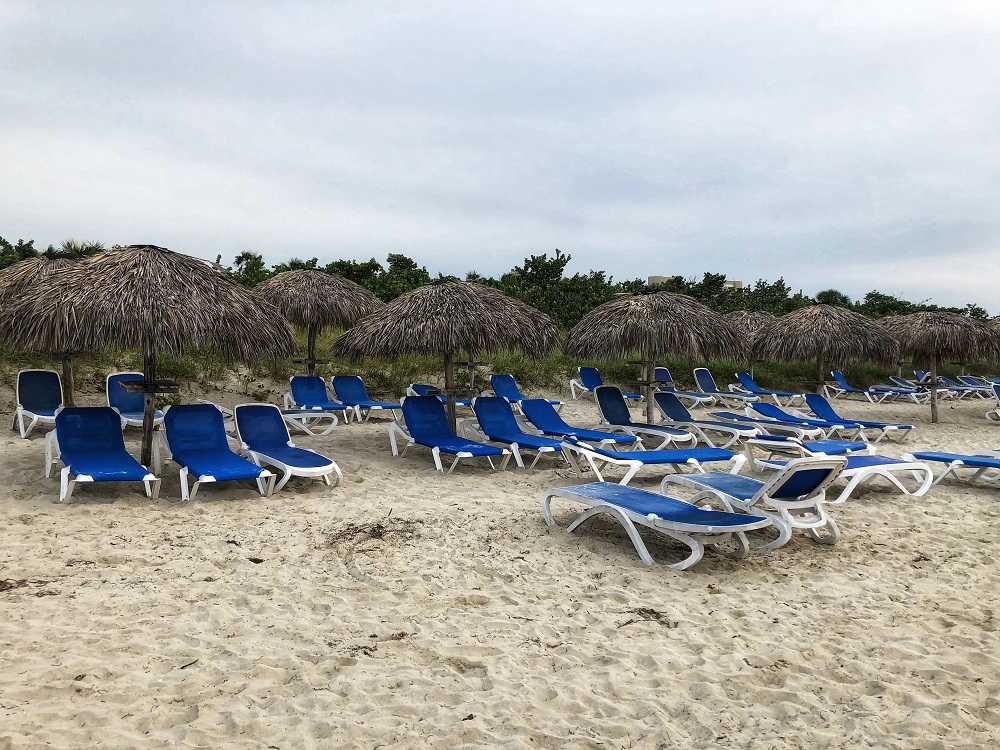 Starfish Varadero resort property view - beach, palm tree beach umbrellas and lounge chairs