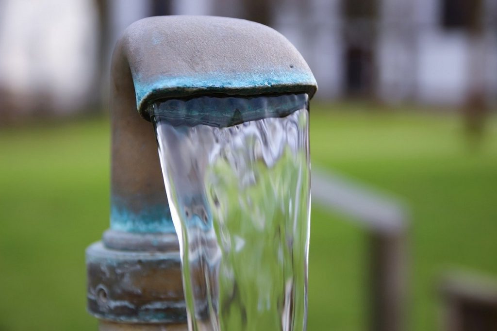outdoor water faucet - sustainability practice of teaching children to value water