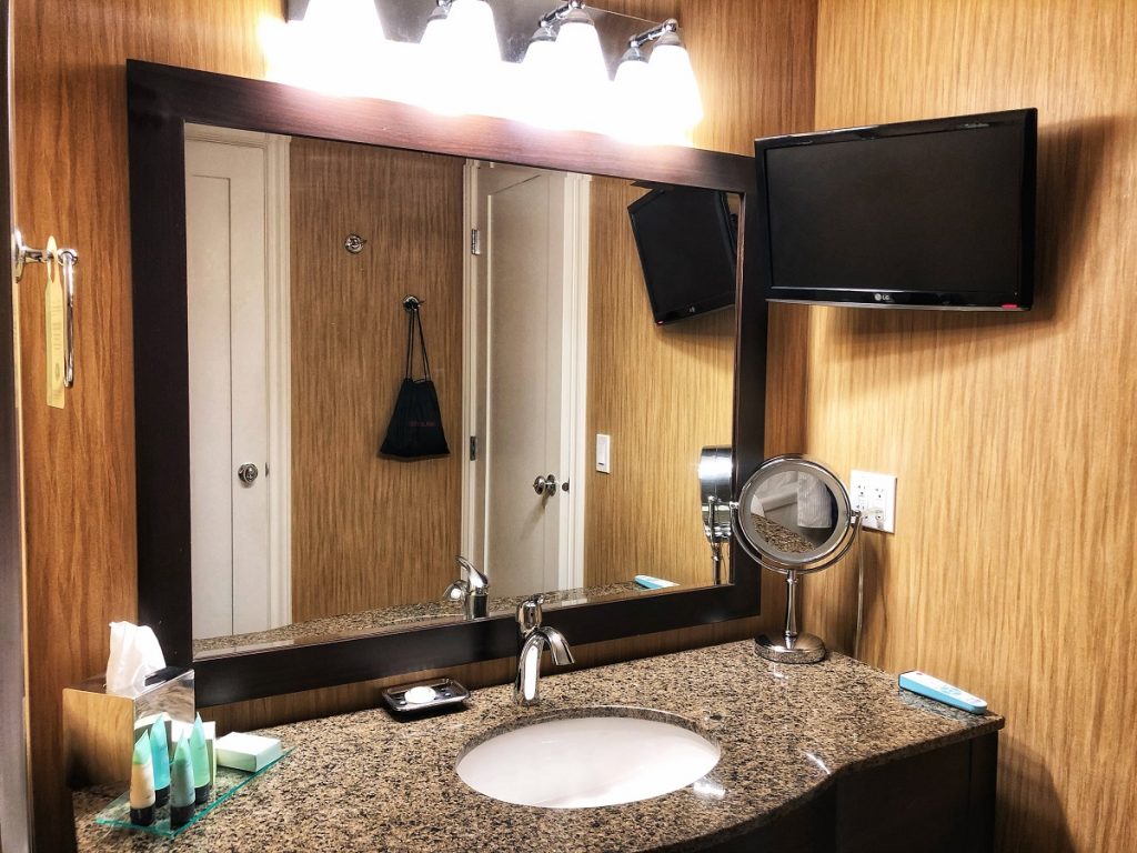 bathroom with a TV