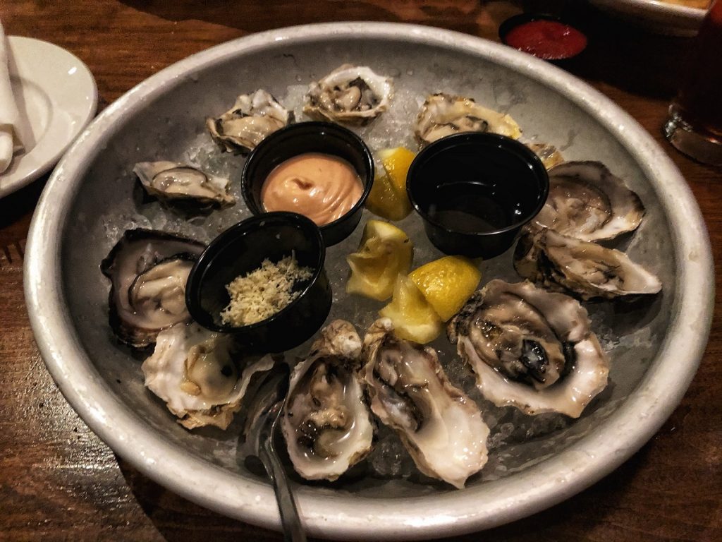 a plate full of oysters from WestCoast Grill 