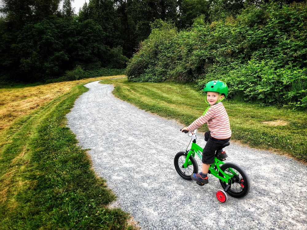 child riding a bicycle - kids outdoor activities and things to do