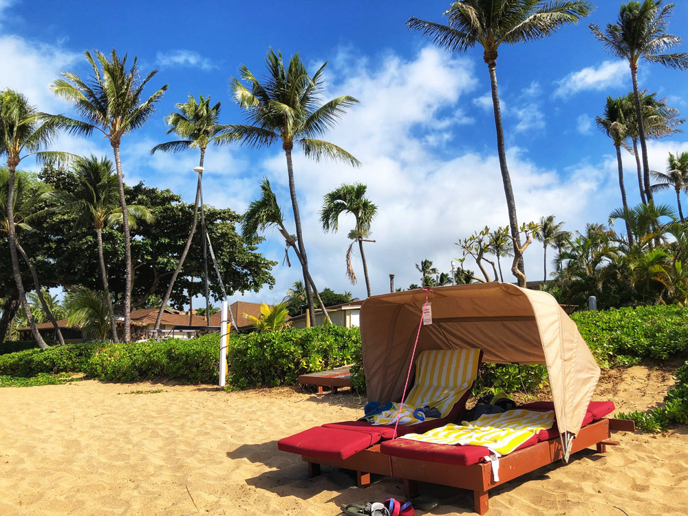 empty beach and lone beach chair at a beach in Maui near aston maui kaanapali villas