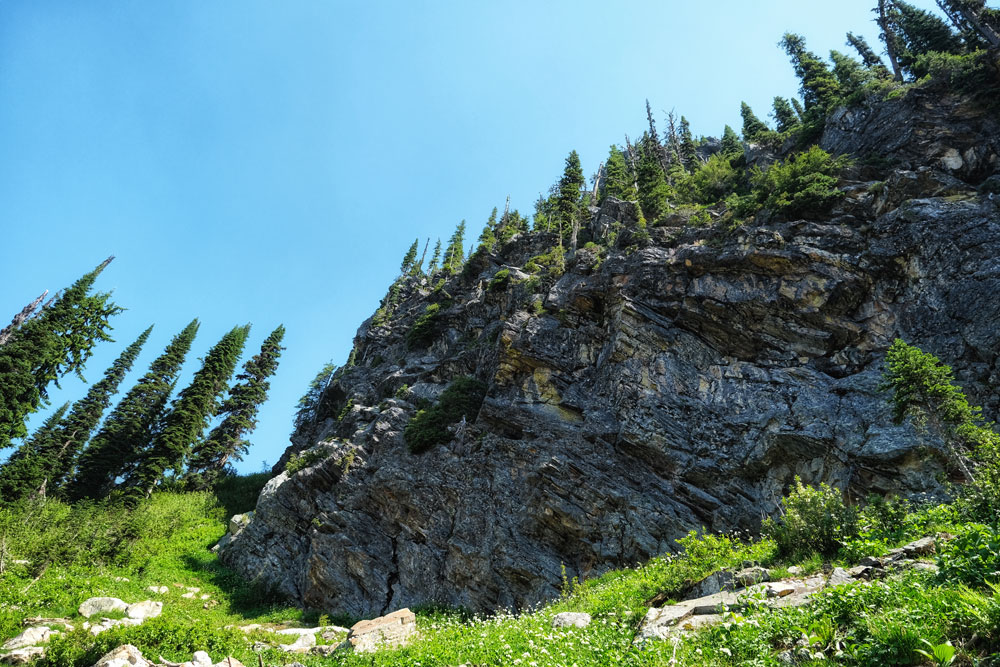 Large rock overhanging the hiking trail