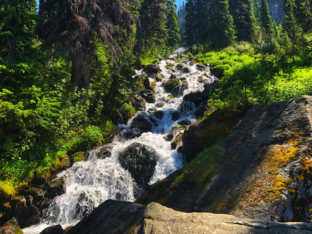 large waterfall crossing the hiking trail to Miller Lake, Revelstoke
