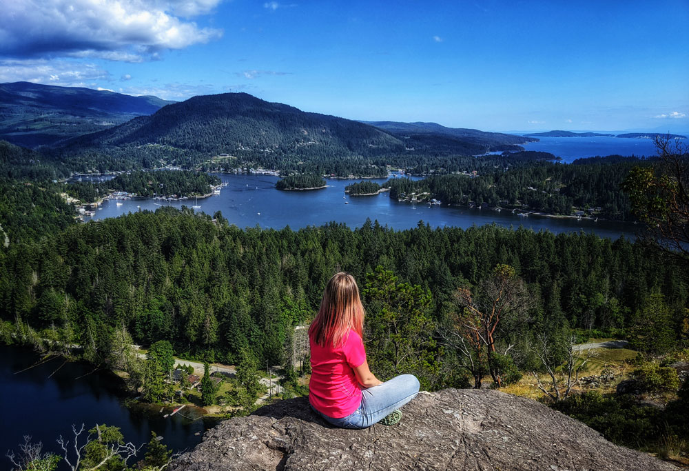 the girl in pink embracing the view of Pender Harbour, and its dozens of islands