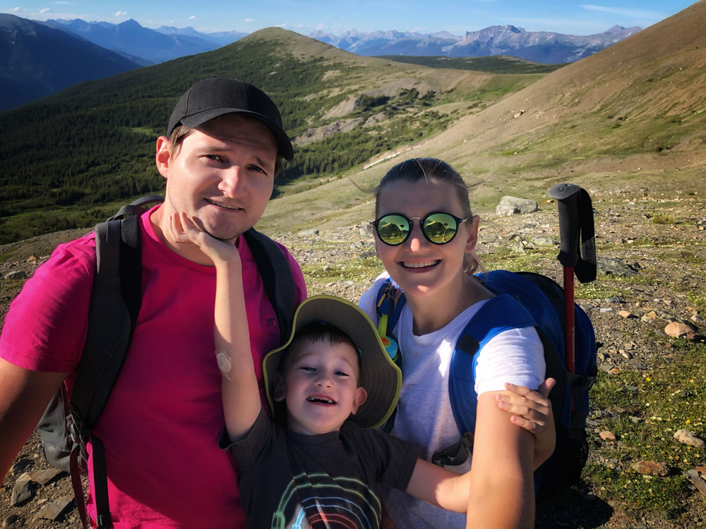 a family is happy to hike all the way to the summit