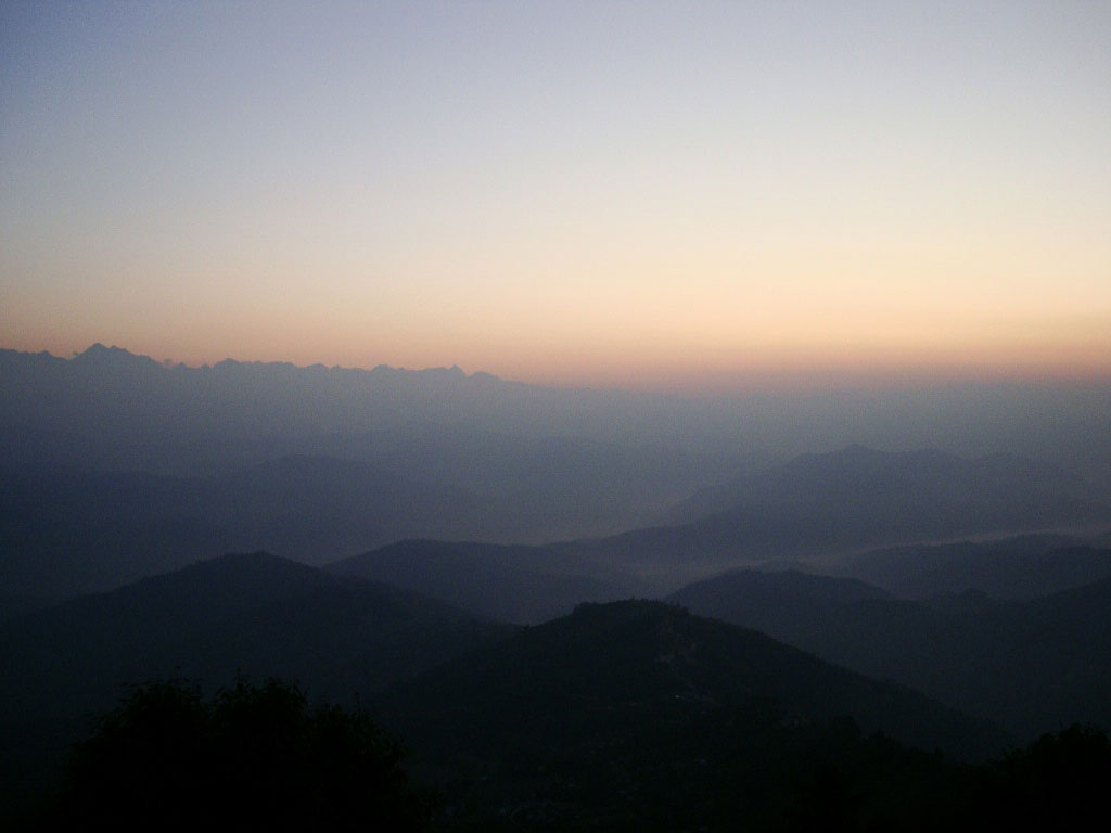 sun is about to come-up over Himalayan mountain peaks in Nepal