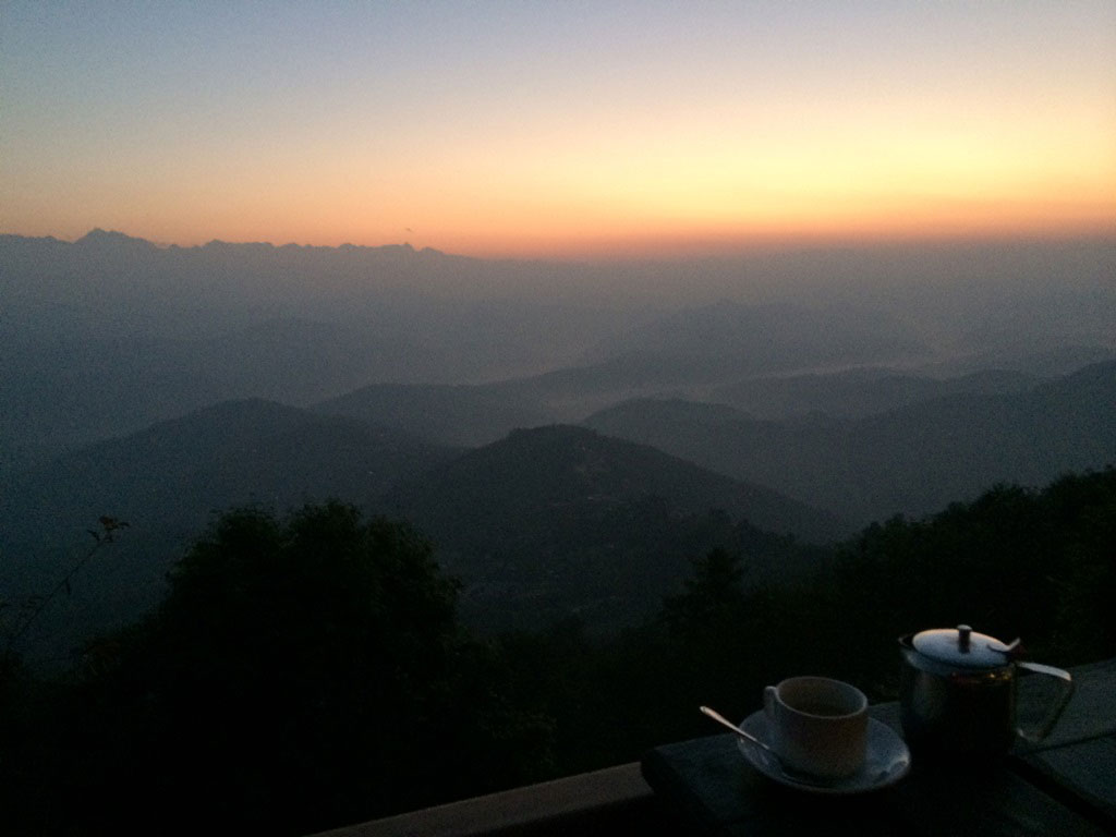 coffee and sunrise over the Himalayas in Nagarkot Nepal
