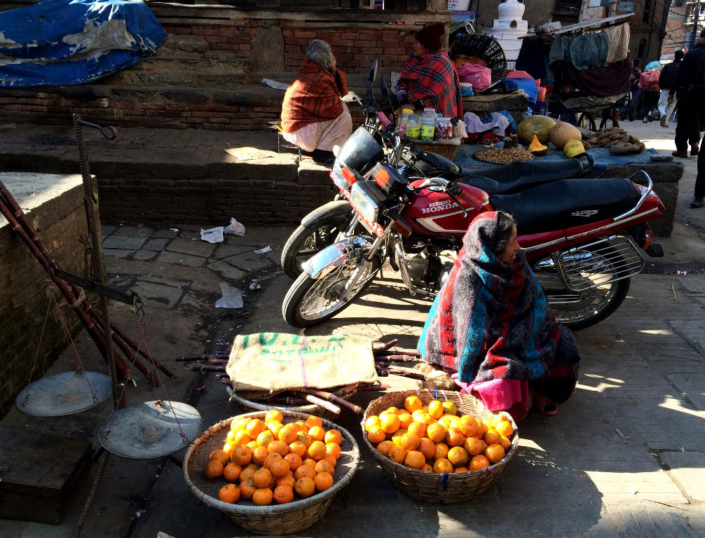 Fruit market with buckets of tangerines
