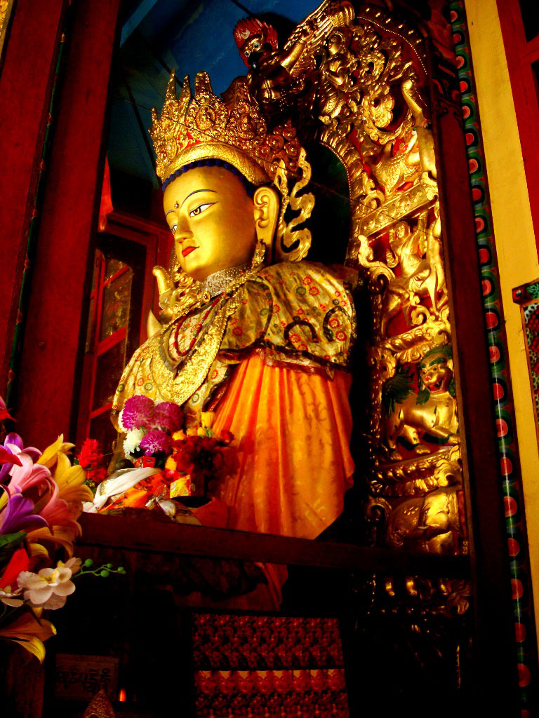 Inside Swayambhunath Temple shrine - the golden statue of Buddha. Kathmandu, Nepal