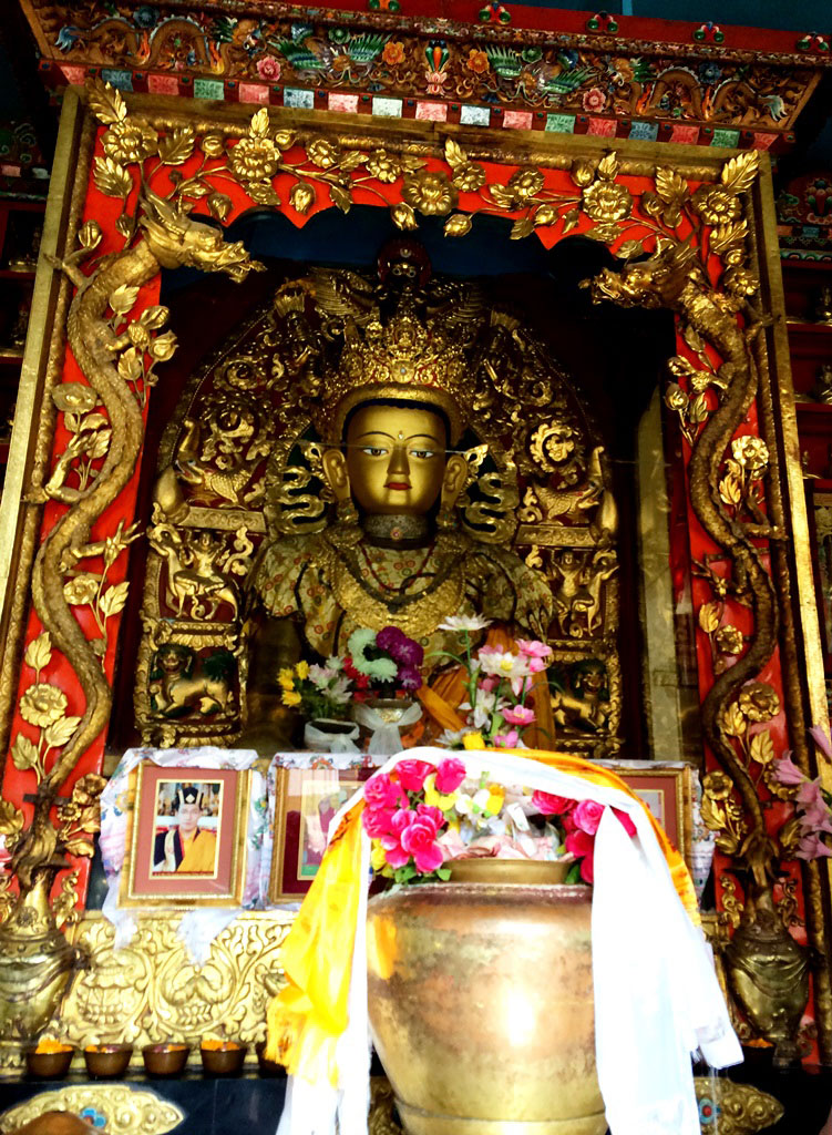 Inside Swayambhunath temple shrine - the golden statue of Buddha. Kathmandu, 2013
