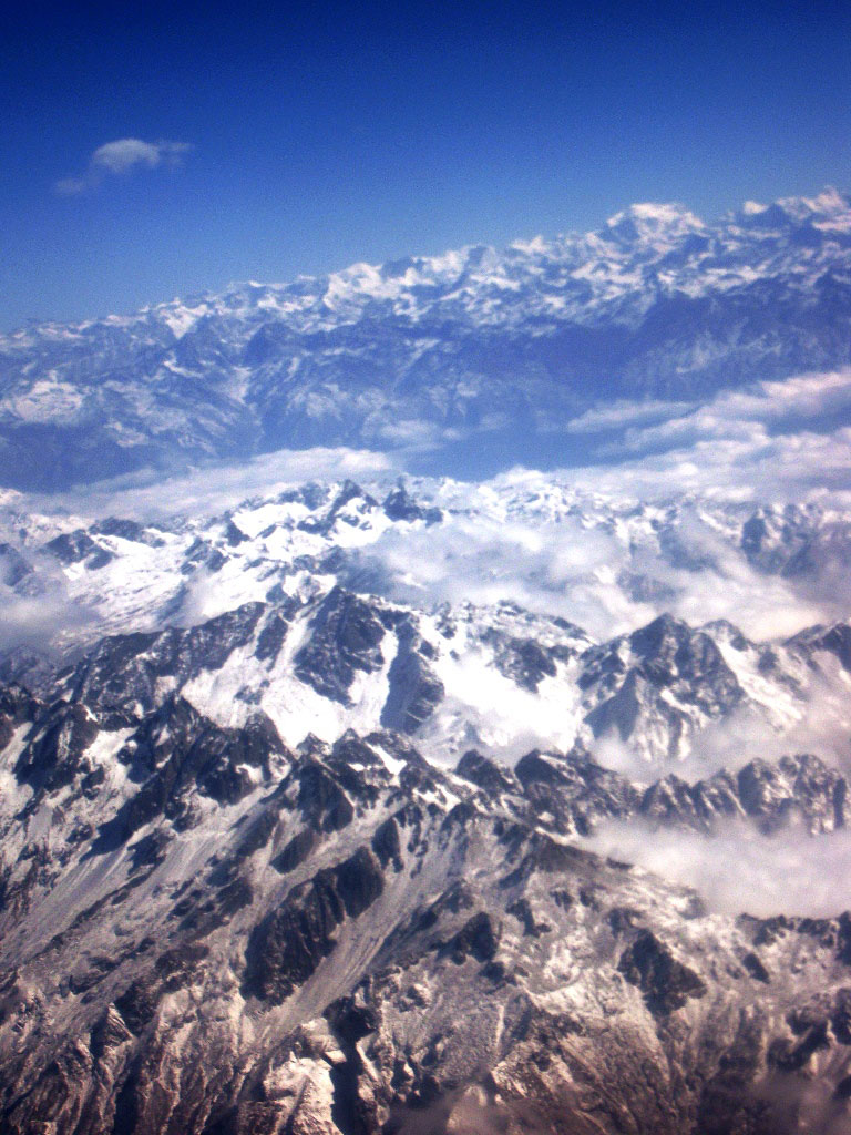 aerial fly over Himalayan mountains tour view from the plane