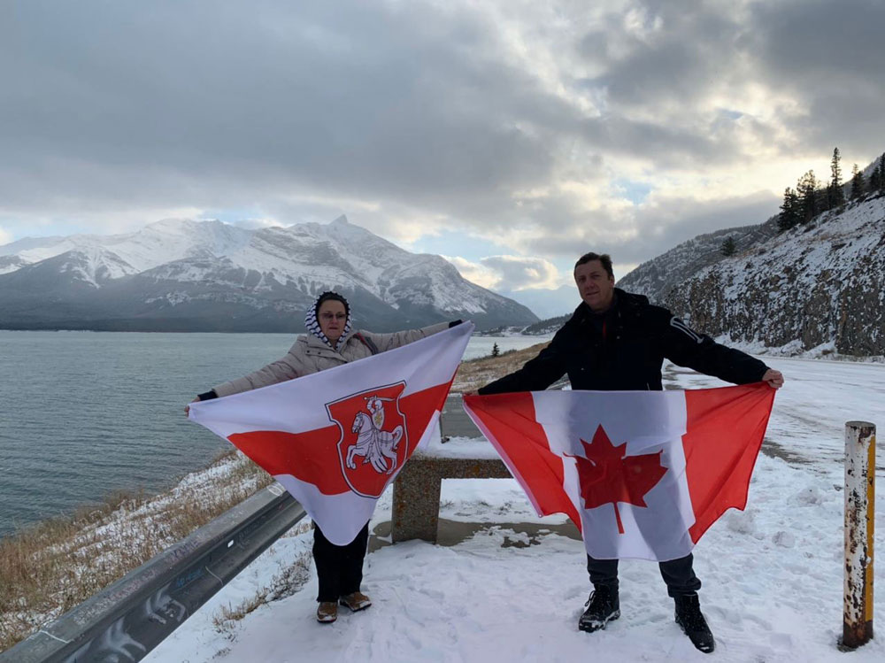 Alberta, Banff, Canada near Abraham Lake - Canadian flag and Belarus Freedom Flag with "Pahonia" coat of arms