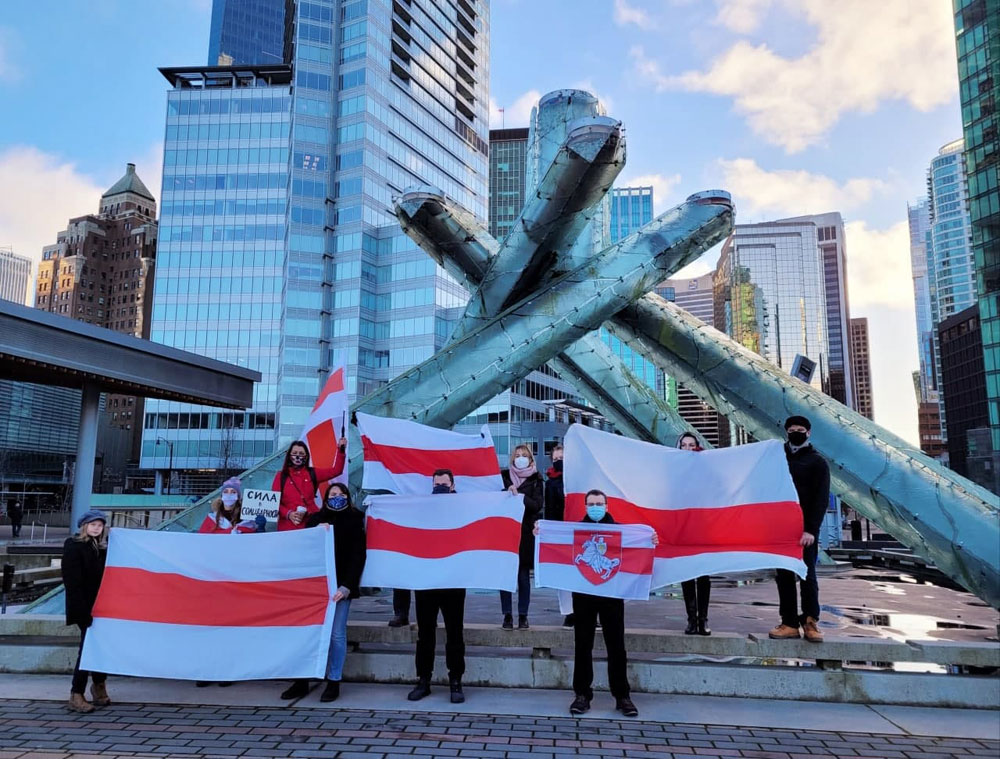 Belarus Freedom Flag near Olympic Flame in Vancouver, British Columbia, Canada