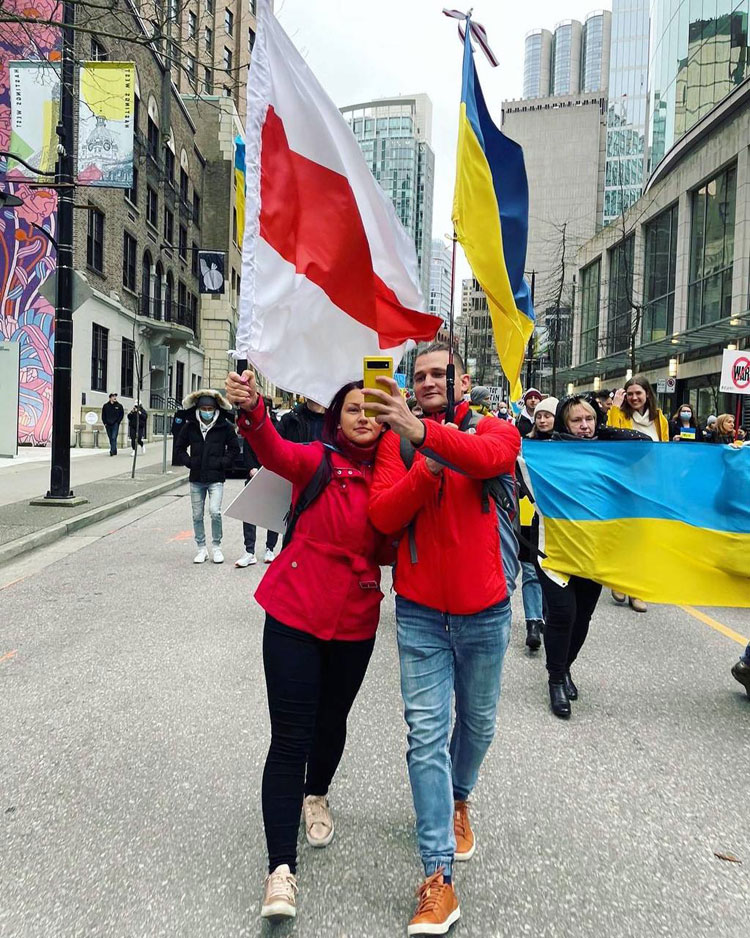 Belarus Freedom Flag and Ukrainian Flag anti-war protest in Vancouver, British Columbia, Canada
