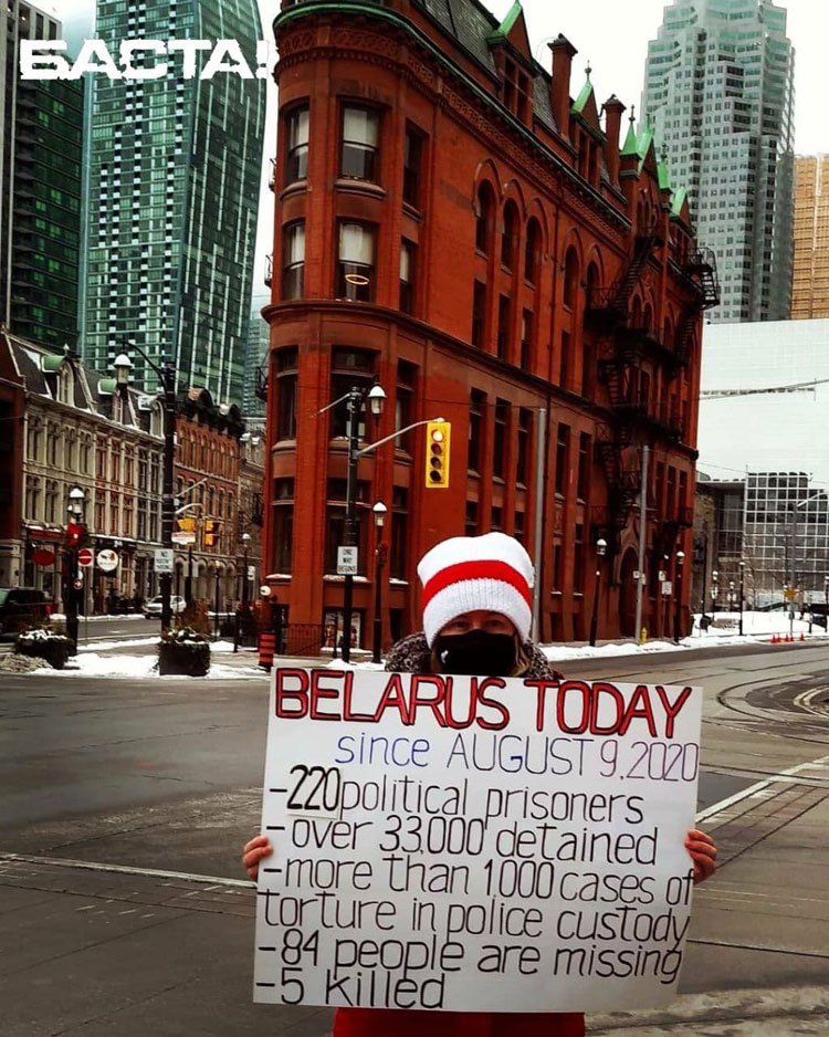 Belarus freedom activist near iconic Gooderham Building (the Flatiron Building) in Toronto, Ontario Canada