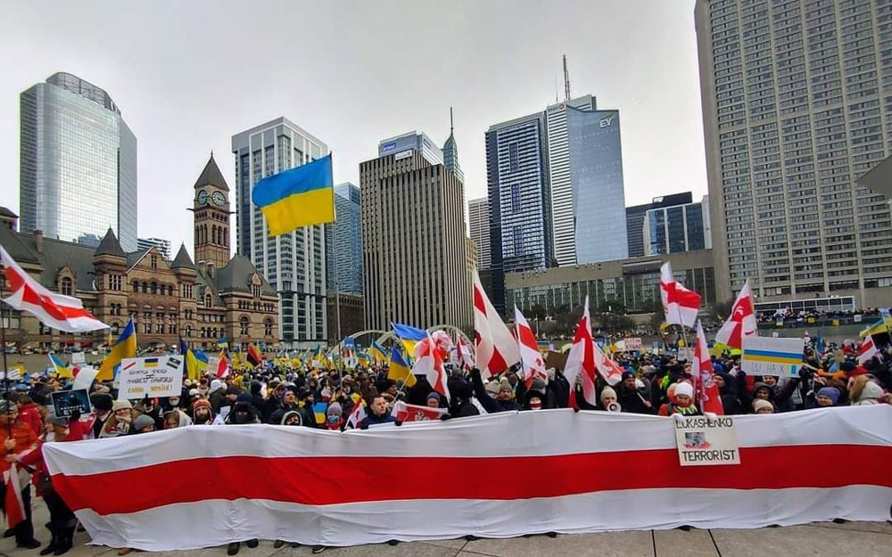 Belarus stands with Ukraine - Belarusian Flags at anti-war protest in Toronto, Ontario Canada