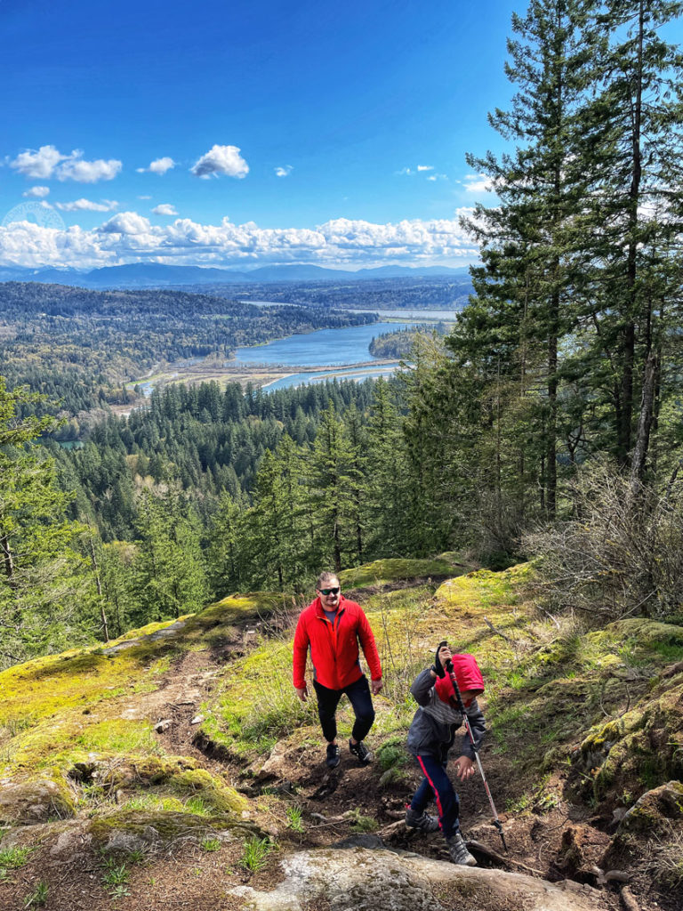 father and son hiking Iron Mountain trail in Mission, British Columbia, Canada