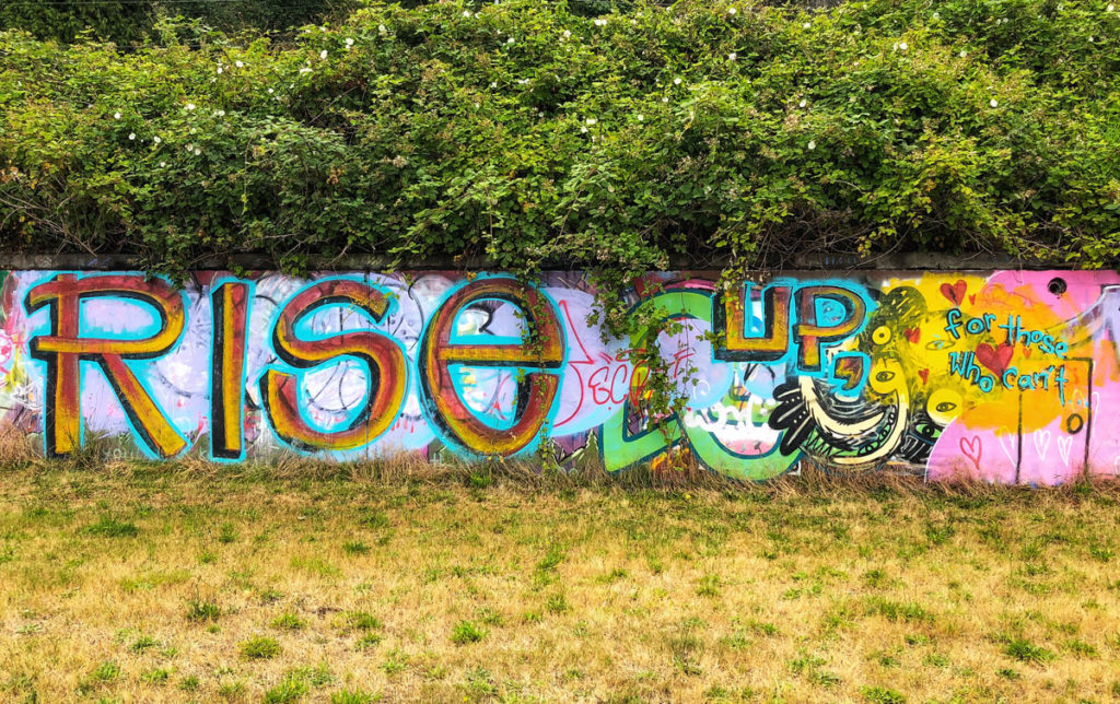 graffiti modern urban street art near Willingdon Beach Park in Powell River, British Columbia Canada - Rise up