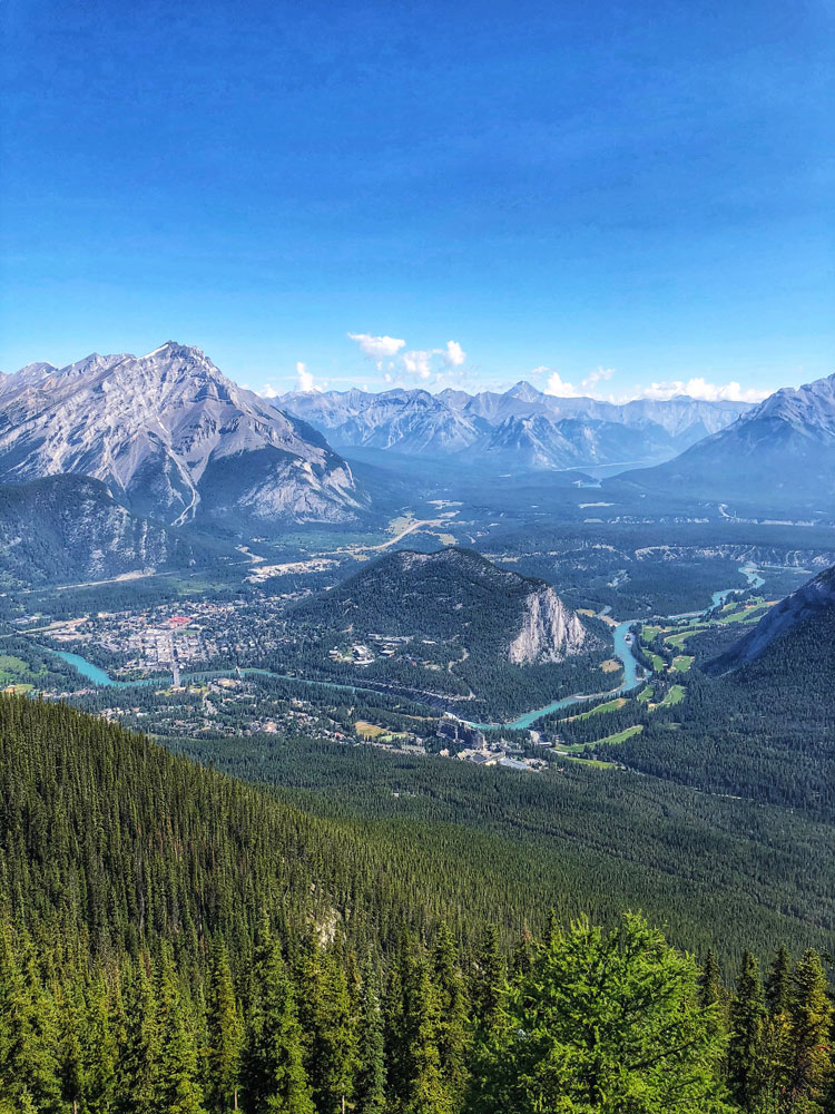 Banff town and Canadian Rockies as seen from Sulphur Mountain Gondola, Alberta Canada vertical